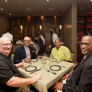 Guests sharing a table in the dining room
