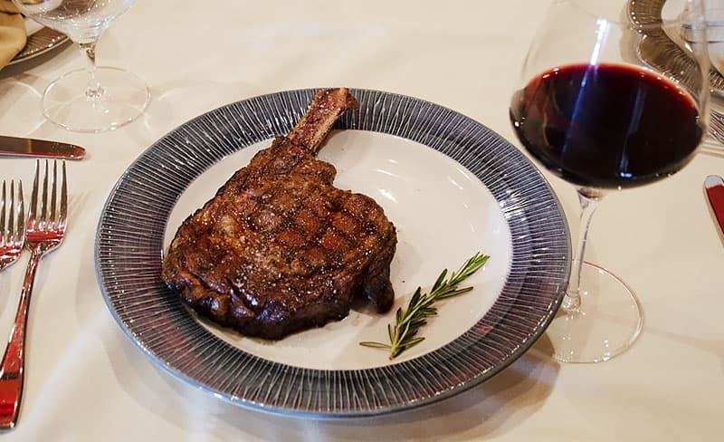 Tomahawk steak with a glass of red wine